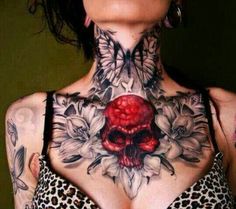 a woman with tattoos on her neck and chest