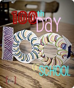 the words 100th day of school are displayed in front of some paper plates and scissors