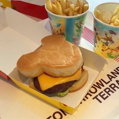 a cheeseburger and fries are sitting on a table