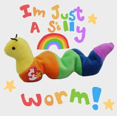 a very cute stuffed animal laying on top of a white background with the words i'm just a silly worm