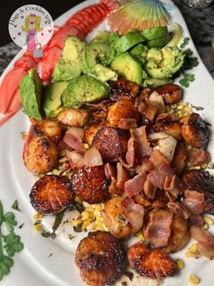 a white plate topped with meat and veggies