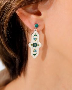 Introducing these exquisite cloisonne enamel earrings crafted from 925 sterling silver, featuring a stunning Anatolian floral motif. These earrings are bursting with a unique design that will add a touch of elegance and beauty to any outfit. Handmade with intricate attention to detail, these earrings are sure to be a standout piece in your jewelry collection. Make a statement with these one-of-a-kind earrings that showcase artistry and craftsmanship at its finest. Perfect for everyday wear or sp White Enamel Bohemian Jewelry, White Bohemian Enamel Jewelry, Traditional White Enamel Earrings, White Meenakari Earrings, Traditional White Jewelry With Inlay, Cloisonne Enamel, Earring Crafts, Enamel Earrings, Handcrafted Earrings