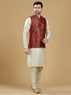 A gold zari brocade vest to pair with any kurta with statement button closures at the front. Occasion: Style this vest with pajama pants and a kurta for a welcome dinner or sangeet night, or style it with a any dress shirt and trousers for a sleek Indian wedding reception look! WASH CARE INSTRUCTIONS - Please Dry clean only. Slight color variation is possible due to digital photography. **Kurta & Pajama not included Traditional Sleeveless Kurta For Festivities, Sleeveless Kurta For Festive Occasions, Sleeveless Festive Kurta For Eid, Festive Brocade Nehru Jacket, Bollywood Brocade Nehru Jacket For Festive Occasions, Festive Brocade Kurta For Puja, Traditional Gold Sleeveless Set, Traditional Vest For Eid Festivities, Traditional Festive Vest For Eid