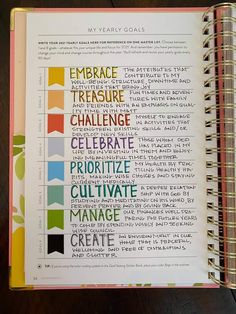 an open planner with colorful writing on it