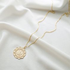 "Our traveler's necklace is perfect for everyday, a statement piece that looks amazing layered, or stunning on its own. St. Christopher is the patron saint of travelers, keeping them safe on their journey. The pendant and necklace are made of high quality 14K gold fill, and are also available in sterling silver. *Free shipping for orders to USA and Canada, and no duties and customs fees.* > Charm says \"St. Christopher Protect Us\" > Shown worn on 20\" box chain > Comes beautifully pack Minimalist 14k Gold-filled Medallion Necklace, Minimalist 14k Gold Filled Medallion Necklace, Everyday 14k Gold Filled Coin Pendant Necklaces, Everyday 14k Gold Filled Necklaces With Coin Pendant, Everyday Gold-plated Tarnish Resistant Medallion Necklace, Everyday 14k Gold Filled Coin Pendant Necklace, Everyday Gold Plated Tarnish Resistant Medallion Necklace, Everyday Gold-plated Tarnish-resistant Medallion Necklace, Delicate Tarnish Resistant Medallion Jewelry