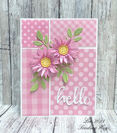 a card with pink flowers and the word hello on it