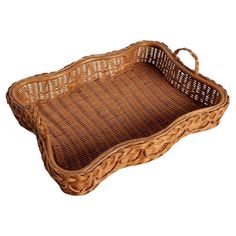 a brown wicker tray with handles