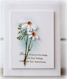 a white card with two daisies on it and the words love from yesterday give for today, one for tomorrow