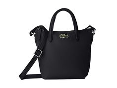 Lacoste Extra Small Shopping Crossbody - Handbags : Black : Pack light with the cute zip PVC and polyurethane with leather Lacoste Extra Small Shopping Crossbody bag with carrying handles and detachable, adjustable crossbody strap. Signature logo detail at front with flat bottom. Lined interior. Imported. Measurements: Bottom Width: 6 in Depth: 3 in Height: 7 in Strap Length: 47 in Strap Drop: 22 in Handle Length: 9 in Handle Drop: 2 1 2 in Weight: 7.4 oz Luxury Michael Kors Bag, Luxury Michael Kors Bag With Detachable Strap, Black Side Bag, Lacoste Bag, Handbags Black, Pack Light, Crossbody Handbags, Back Bag, Side Bags