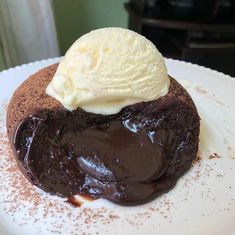 a piece of chocolate cake with ice cream on top