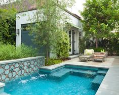 a small pool in the middle of a backyard