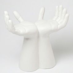 two white hands that are in the shape of a person's arm and hand