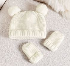 Our Baby Hat And Mittens Set in White is perfect for keeping little ones snuggly all season. Made from a cozy knitted fabric, sure to keep them as cuddly as can be. All wrapped up in a sweet bow, this set makes the most beautiful gift for every new mom and mommy-to-be.  Perfect for babies 0-6 months old.   Super soft-touch knit with cute pompom ears on the hat Features soft cotton lining to be kind to babies skin  081324AP Baby Hat And Mittens, Wedding Gift Set, Honeymoon Gifts, Personalized Gift Bags, Baby Changing Bags, To Be Kind, Work Gifts, Our Baby, Baby Gift Sets