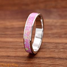 Solid 925 Sterling Silver 4mm Width Pink Opal Inlay Wedding Ring Band ▷Gift Box Included ▷Size 5- 10 Available ▷4mm Height ▷High-Quality Lab Created Pink Opal ▷925 Sterling Silver (not plated or filled) ▷925 Stamp Authenticity Pink Sterling Silver Opal Ring For Anniversary, Pink Opal Ring In Sterling Silver For Anniversary, White Band Jewelry Gift, Pink Band Jewelry For Gifts, Pink Band Jewelry Gift, Pink Sterling Silver Stackable Rings For Wedding, Silver Opal Toe Ring For Wedding, Pink Wedding Rings With Polished Finish, Opal Promise Ring