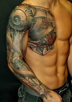 a man with tattoos on his arm and chest