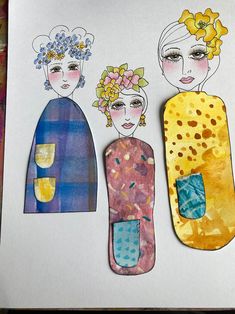 three paper dolls made to look like they are wearing different colors and designs on them