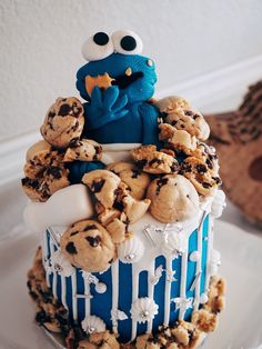 a cake with cookies and cookie monster on top