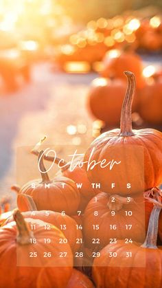 a calendar with pumpkins in the background