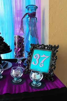 the table is decorated with purple and blue decorations