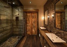 a bathroom with two sinks and a large wooden door in the middle of the room