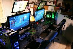 there are many computer screens on the desk