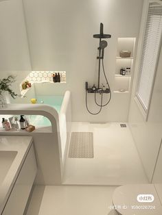 a white bathroom with a sink, shower and bathtub in the middle of it