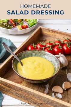 homemade salad dressing in a bowl on a wooden tray with mushrooms, tomatoes and garlic