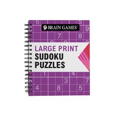 the large print sudoku puzzles book is purple and has numbers on it, as well as an arrow