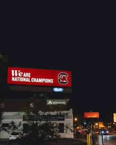 there is a large sign on the side of this building that says we are national champs