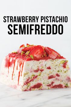 strawberry pistachio semfreddo cake on a marble surface