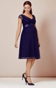 A fun and flirty take on our floor sweeping gown by the same name, our Kristin maternity dress has the same A-list glamour, romantic sweetheart neckline and exquisite eyelash lace from head to toe. •Deep indigo blue eyelash lace •Vintage-feel with satin-edged sweetheart neckline •Scalloped eyelash edge cap sleeve •Subtle stretch to grow with you •Baby-soft premium jersey lining •Pretty sheer cap sleeve and neckline •Flattering swishy knee length skirt •Lovingly designed and made in Britain Elegant Maternity Dress With Sweetheart Neckline, Blue Lace Bridesmaid Dress, Maternity Wear Dresses With Lace Trim, Maternity Wedding Dress With Sweetheart Neckline, Elegant Maternity Dress With Empire Waist, Elegant Maternity Dress With Lace Trim, Elegant Maternity Dresses With Scalloped Lace, Elegant Blue Maternity Dress With V-neck, Elegant Blue V-neck Maternity Dress