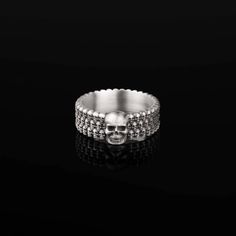 "This Skull Band Ring is a bold representation of life's transient beauty, handcrafted from 925 sterling silver. Each detail of the Gothic Skull Band emanates a powerful energy that captures the spirit of the bold and the brave. It's a statement piece for bikers, rockers, or anyone who appreciates edgy, dark fashion. The Skull Artistry Ring is unisex, designed for anyone who dares to stand out. Whether you're into punk, gothic, or prefer the macabre style, this Unique Skull Band has your name. ✦ Silver Stainless Steel Jewelry For Biker Events, Skull Shaped Sterling Silver Ring In White Gold, Silver Engraved Jewelry For Biker Events, Punk Skull Jewelry For Biker Events, Gothic Skull Jewelry For Biker Events, Punk Skull Ring In Sterling Silver, Punk Style Sterling Silver Skull Ring Gift, Punk Sterling Silver Skull Ring Gift, Adjustable Silver Jewelry For Biker Events