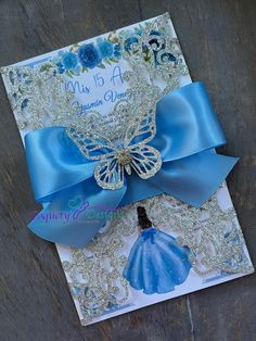 a blue and white card with a butterfly on it