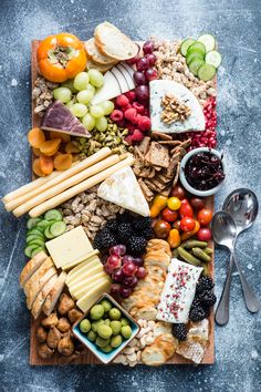 a table filled with lots of different types of fruit and crackers on top of it