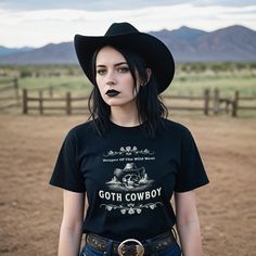 Step up your fashion game with our Goth Cowboy Shirt, a perfect fusion of gothic aesthetics and western flair. Western Gothic trends keep gaining steam. Hop on the train headed for the Far West! Made from high-quality, soft cotton, this Goth Cowgirl shirt is as comfortable as it is stylish. Available in a range of sizes from S to XXL, the flattering fit and durable material ensure that you'll look and feel your best whether you're at a festival, a rodeo, or just out on the town. ► Check out our Gothic Cowgirl, Goth Cowgirl, Goth Cowboy, Western Goth, Western Gothic, Victorian Gothic Style, Gothic Elements, Goth Shirt, Cowboy Shirt