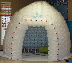 an inflatable arch with red, white and blue dots on the front door