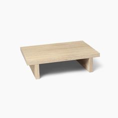 a small wooden table with no legs on it