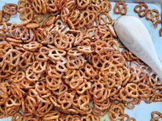 a spoon is sitting on top of some pretzels