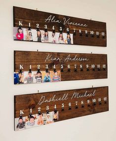 three wooden signs hanging on the wall with family photos and date names attached to them