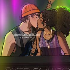 two people kissing each other while standing in front of a keyboard with neon lights behind them