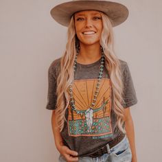 This desert shirt is anything but dry! Printed on Next Level material, this unisex desert t shirt is dark grey with a desert and skull graphic centerpiece. Wear it with denim shorts and sneakers for a comfy summer look! Unisex Made in the USA Next level material Cowgirl Outfits For Women, Mode Country, Steer Skull, Southern Outfits, Country Style Outfits, Western Wear Outfits, Cute Country Outfits, Rodeo Outfits, Western Style Outfits