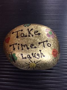 a rock that says take time to laugh