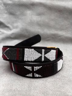 The Belts are made from ethically sourced leather in Kenya. The collars are then hand beaded by Maasai women artisans from my Village in Kajiado who have mastered the art. The hardware is made from 100% recycled brass. TO MEASURE CORRECTLY If you know your pants waist size, you can follow the add-two-inches rule i.e if your pants waist measurement is 32 Inches, then your belt size will be 34-36 Inch Belt. Our measurements are from the tip of the Buckle of the Belt to the second hole after the be Traditional Black Adjustable Belts, Artisan Adjustable Fabric Belt, Adjustable Artisan Embroidered Belt, Artisan Embroidered Adjustable Belts, Traditional Adjustable Fabric Belt, Handmade Belt, Boho Belt, Boho Belts, Handmade Belts