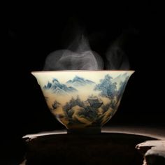 a bowl with steam rising out of it