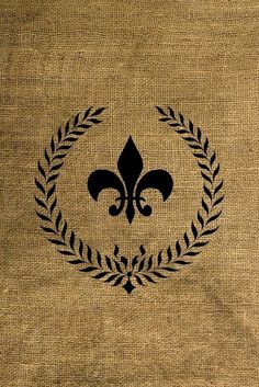 a black fleur de lis emblem on a burlock