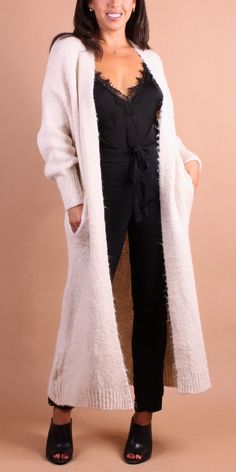 Cozy Long Sweater Cardigan with Pockets. Features a Soft & Fluffy Mohair Knit. 50% Acrylic | 29% Viscose | 12% Nylon | 9% Mohair Made in Italy One Size Model 5'7" Winter Cream Sweater Coat For Layering, Cream Sweater Coat For Winter Layering, Cozy Sweater Coat In Winter White For Cold Weather, Long Cream Cardigan For Winter, Cozy Winter White Sweater Coat For Cold Weather, Cozy Long Cream Outerwear, Cream Cardigan For Winter Layering, Winter Cream Cardigan For Layering, Winter White Cardigan For Layering In Winter