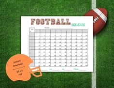 a football and helmet sitting on top of a field next to a printable calendar