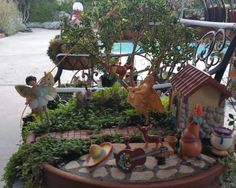 a potted planter filled with fairy figurines