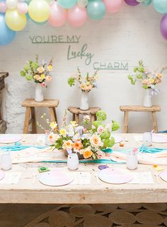 a table topped with lots of different types of cakes