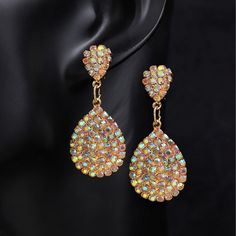 Material: Rhinestone Style: Simple Metal Drop Crystal Earrings For Party, Metal Rhinestone Crystal Earrings For Party, Crystal Jewel Drop Earrings, Party Crystal Rhinestone Metal Earrings, Party Crystal Earrings With Rhinestones, Dazzling Metal Crystal Earrings With Rhinestones, Dazzling Crystal Rhinestone Metal Earrings, Gold Crystal Earrings With Jewels, Jeweled Crystal Dangle Earrings